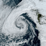 Low pressure center spins off the coast