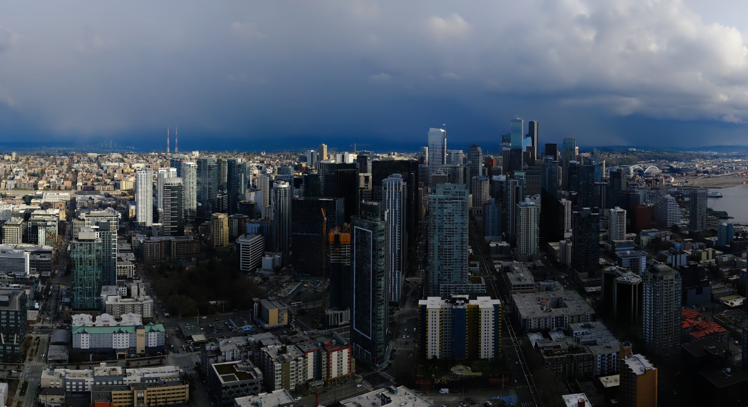 A snow shower falls in the distance to the south of Seattle as seen from the Space Needle on Feb. 17, 2026. (Photo: Space Needle Web Camera)